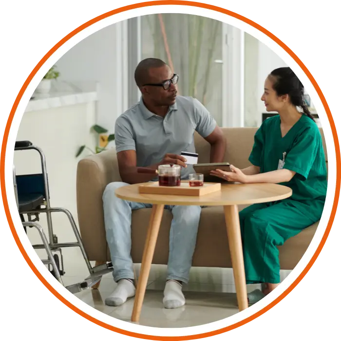 Nurse with disabled man at home