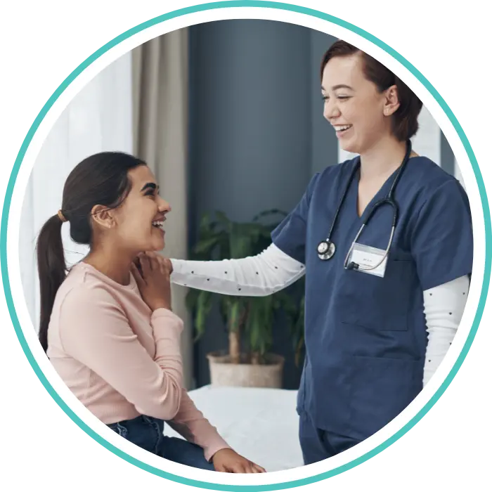 Nurse smiling with NDIS participant