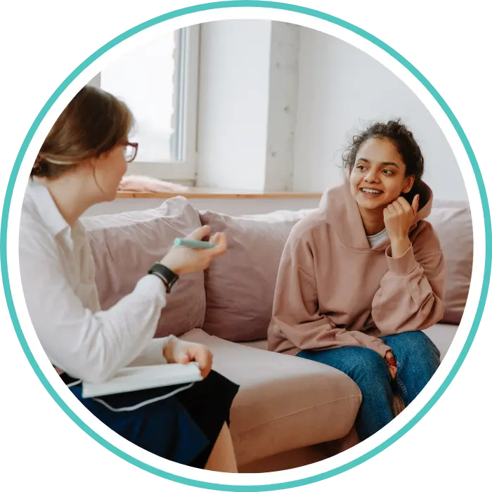 Counsellor with participant talking happily